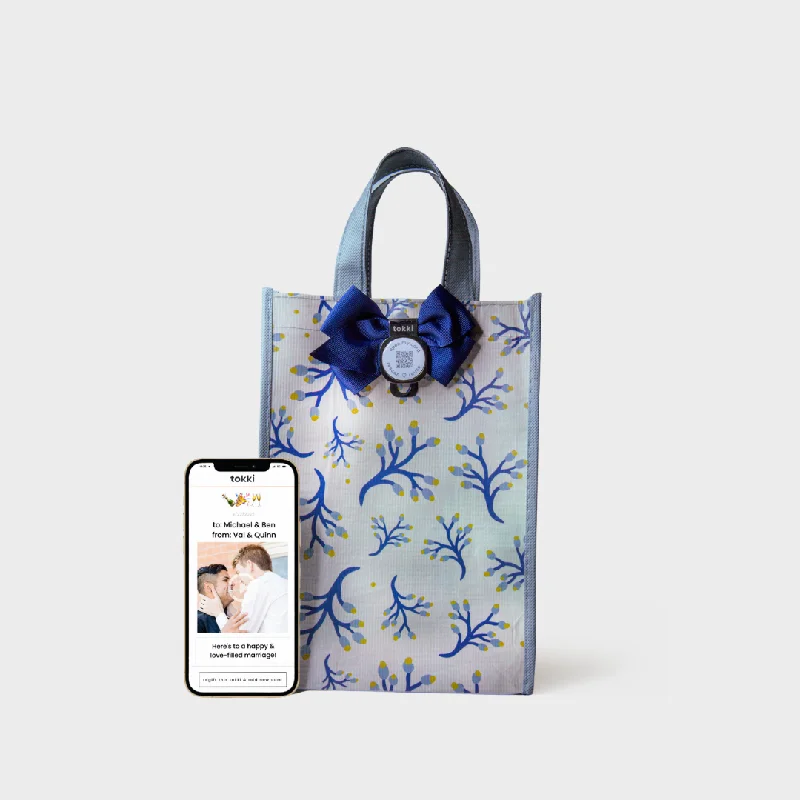 Colorful paper shopping and gift bags with intricate embossed patterns for party favorsArise | Medium | Reusable Gift Bag + QR Greeting Card