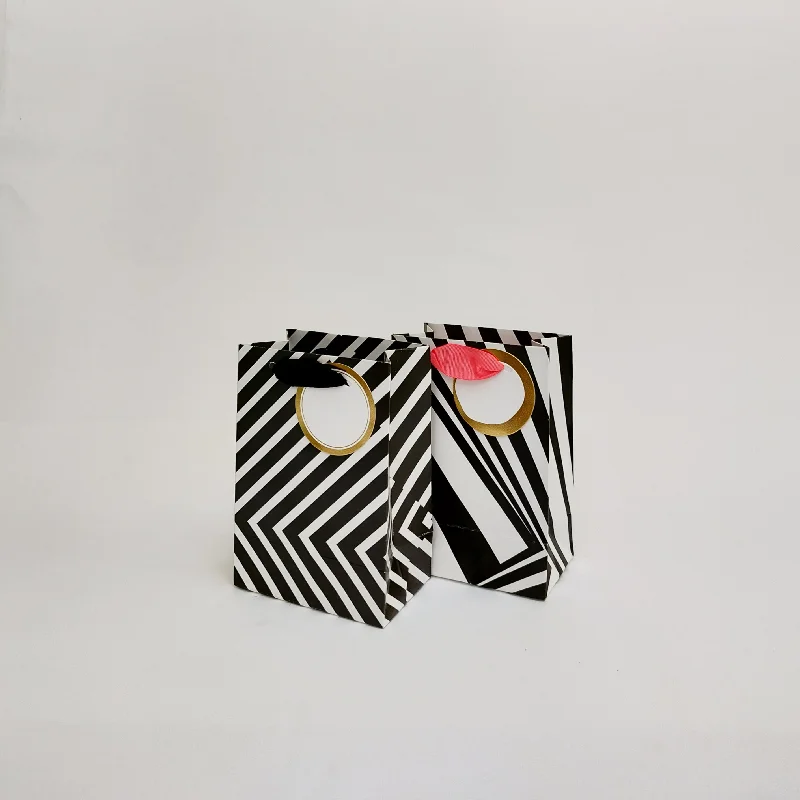 Luxury leather shopping and gift bags with gold - plated hardware for high - end presentsIllusion Small Gift Bags Luxury leather shopping and gift bags with gold - plated hardware for high - end presentsIllusion Small Gift Bags