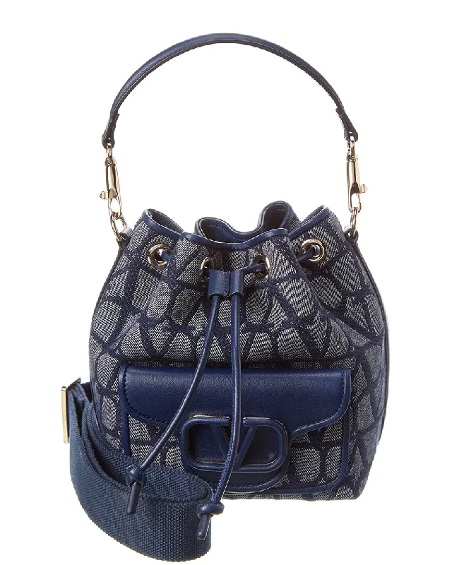 Canvas Bucket Bag in Navy Blue with Striped Interior for a Nautical - Inspired Outfit Valentino VLogo Toile Iconographe Canvas & Leather Bucket Bag Canvas Bucket Bag in Navy Blue with Striped Interior for a Nautical - Inspired Outfit Valentino VLogo Toile Iconographe Canvas & Leather Bucket Bag