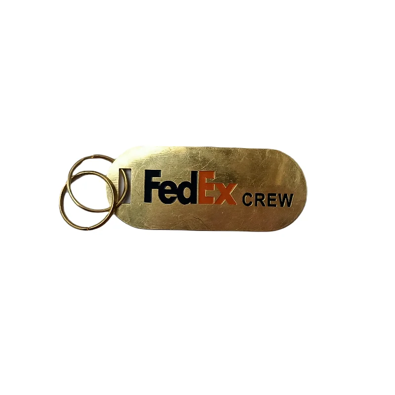 Recycled Canvas Shoulder Bag for Eco - Conscious Consumers FEDEX CREW BRASS TAG OVAL GOLDEN Recycled Canvas Shoulder Bag for Eco - Conscious Consumers FEDEX CREW BRASS TAG OVAL GOLDEN