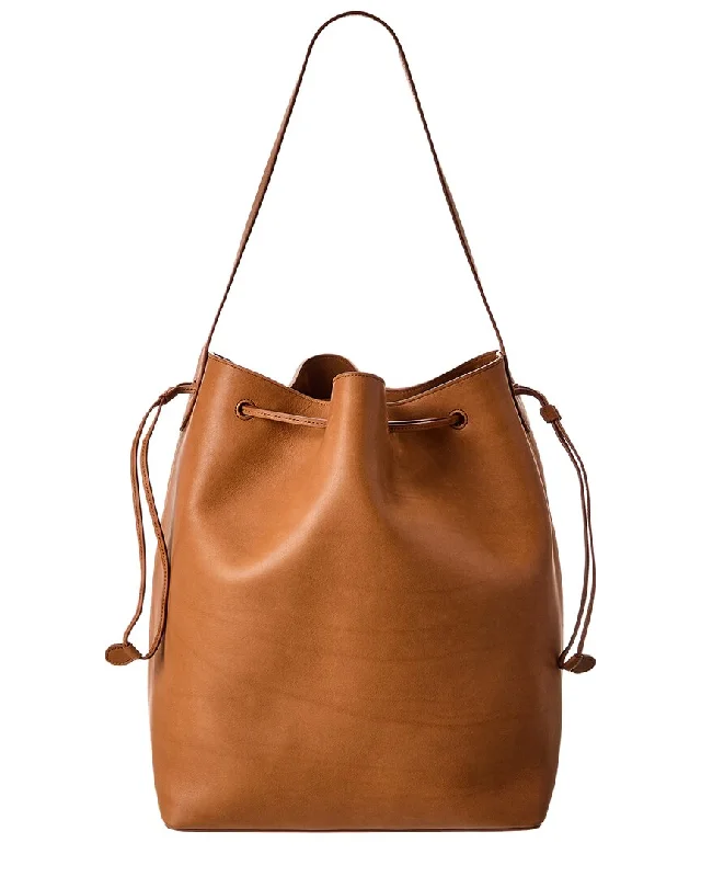 Canvas Bucket Bag in Navy Blue with Striped Interior for a Nautical - Inspired Outfit The Row Belvedere Leather Bucket Bag Canvas Bucket Bag in Navy Blue with Striped Interior for a Nautical - Inspired Outfit The Row Belvedere Leather Bucket Bag