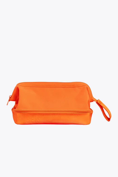 Travel bag with a built - in power bank charger for on - the - go device chargingThe Dopp Kit in Creamsicle Travel bag with a built - in power bank charger for on - the - go device chargingThe Dopp Kit in Creamsicle