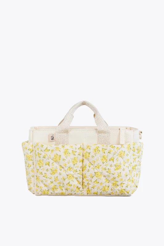 Travel bag with a built - in power bank charger for on - the - go device chargingThe Caddy in Garden Party Travel bag with a built - in power bank charger for on - the - go device chargingThe Caddy in Garden Party