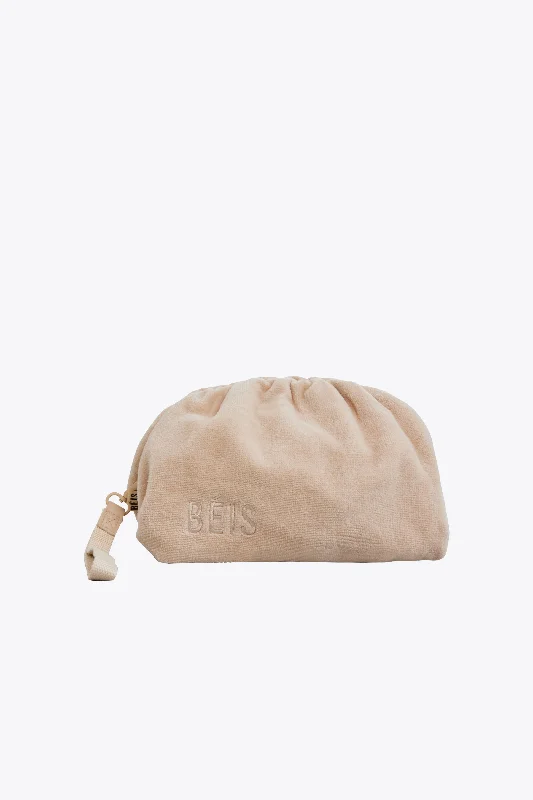 Travel bag with a retractable garment rack for easy unpackingThe Terry Cosmetic Clutch in Beige Travel bag with a retractable garment rack for easy unpackingThe Terry Cosmetic Clutch in Beige