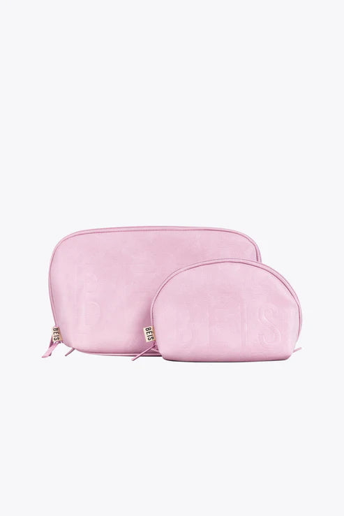 Vintage leather travel bag with brass accents for a classic and sophisticated lookThe Cosmetic Pouch Set in Atlas Pink Vintage leather travel bag with brass accents for a classic and sophisticated lookThe Cosmetic Pouch Set in Atlas Pink