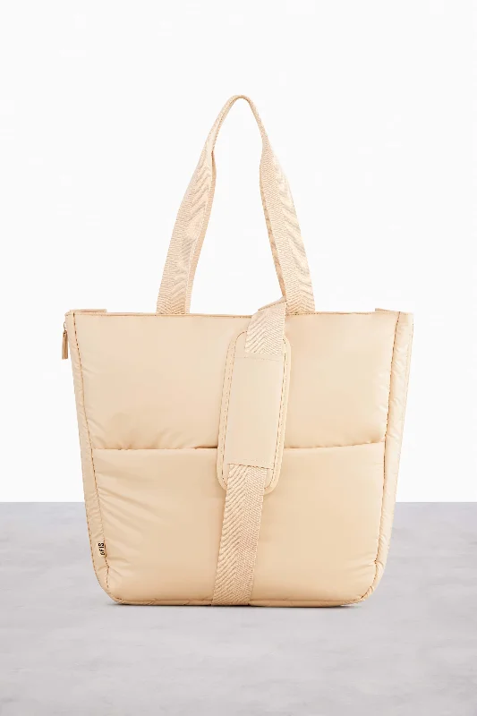 Waterproof canvas travel bag suitable for beach and outdoor vacationsThe Expandable Tote in Beige