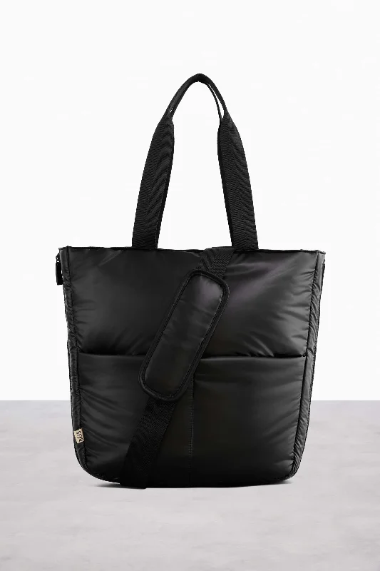 Smart travel bag with integrated GPS tracker for lost item recoveryThe Expandable Tote in Black Smart travel bag with integrated GPS tracker for lost item recoveryThe Expandable Tote in Black