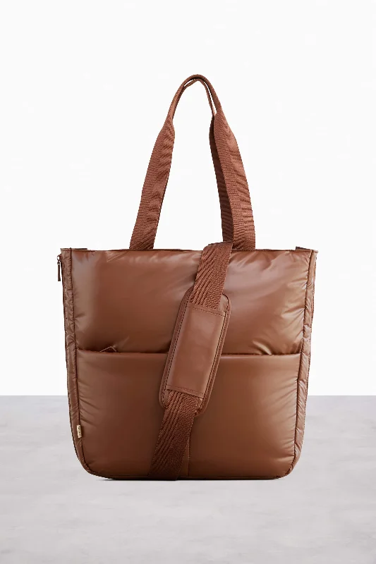 Compact carry - on travel bag with spinner wheels for easy maneuvering in airportsThe Expandable Tote in Maple Compact carry - on travel bag with spinner wheels for easy maneuvering in airportsThe Expandable Tote in Maple