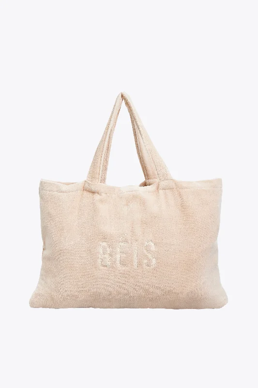 Designer - branded leather travel bag for luxury business travelersThe Terry Towel Tote in Beige Designer - branded leather travel bag for luxury business travelersThe Terry Towel Tote in Beige