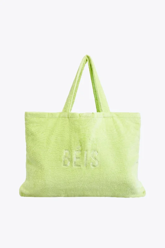 Stackable travel bag set with various sizes for diverse packing needsThe Terry Towel Tote in Citron Stackable travel bag set with various sizes for diverse packing needsThe Terry Towel Tote in Citron