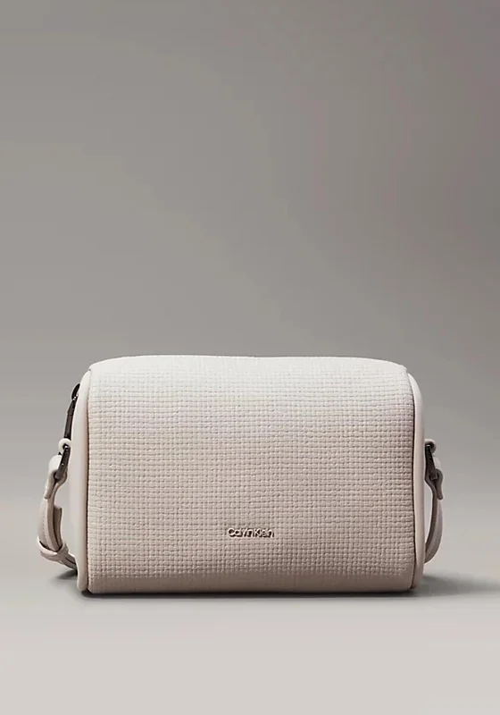 Designer men's crossbody bag with a unique pattern or logoDesigner men's crossbody bag with a unique pattern or logoCalvin Klein Pebbled Crossbody Bag, Sand Designer men's crossbody bag with a unique pattern or logoDesigner men's crossbody bag with a unique pattern or logoCalvin Klein Pebbled Crossbody Bag, Sand