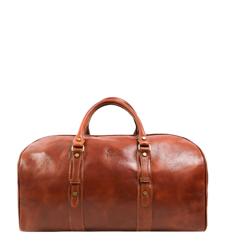 Vintage leather travel bag with brass accents for a classic and sophisticated lookVintage leather travel bag with brass accents for a classic and sophisticated lookLeather Duffel Bag, Weekender Bag for Women - Song of Solomon Vintage leather travel bag with brass accents for a classic and sophisticated lookVintage leather travel bag with brass accents for a classic and sophisticated lookLeather Duffel Bag, Weekender Bag for Women - Song of Solomon