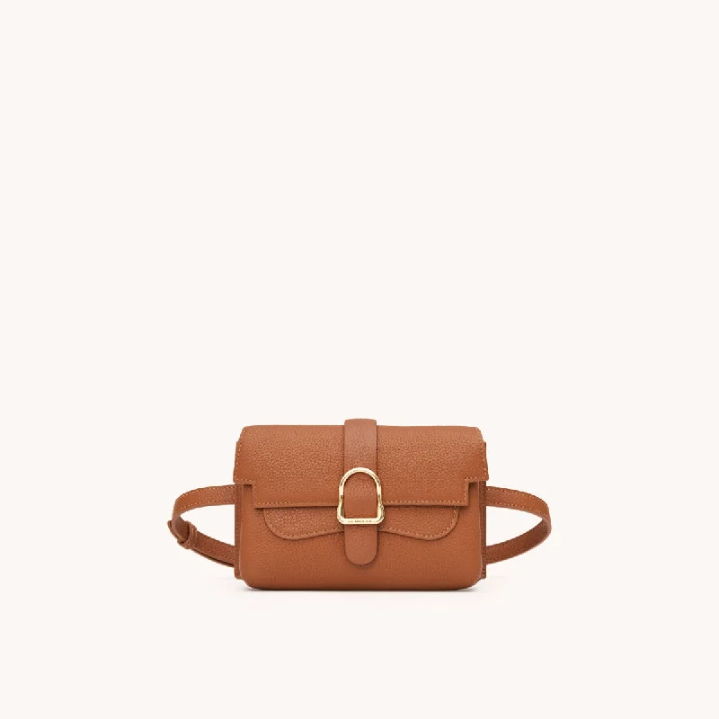 Vintage leather travel bag with brass accents for a classic and sophisticated lookVintage leather travel bag with brass accents for a classic and sophisticated lookMini Aria Élevée Belt Bag | Piccola Vintage leather travel bag with brass accents for a classic and sophisticated lookVintage leather travel bag with brass accents for a classic and sophisticated lookMini Aria Élevée Belt Bag | Piccola