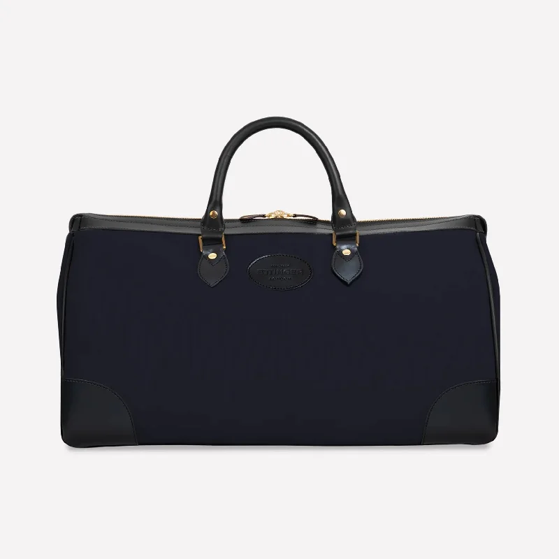 Lightweight nylon duffel travel bag with multiple exterior pockets for quick accessLightweight nylon duffel travel bag with multiple exterior pockets for quick accessNew Hurlingham Overnight Bag - Navy Lightweight nylon duffel travel bag with multiple exterior pockets for quick accessLightweight nylon duffel travel bag with multiple exterior pockets for quick accessNew Hurlingham Overnight Bag - Navy
