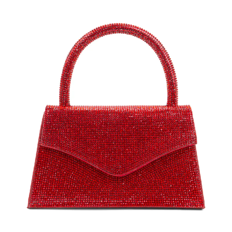 Velvet clutch with a tassel detail for a bohemian - chic styleBAMINA RED MULTI