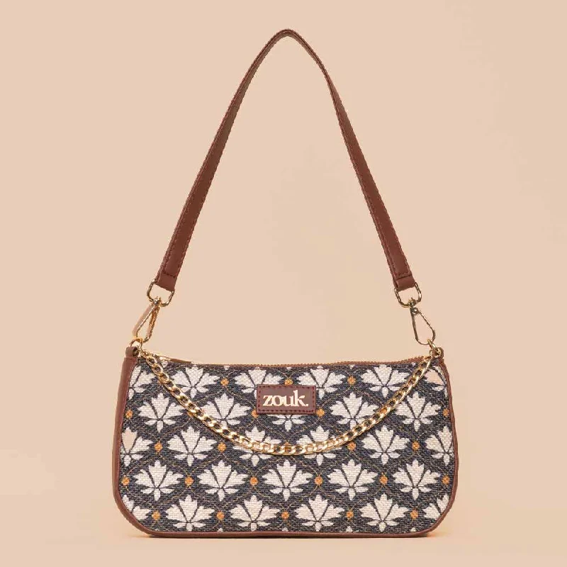 Mother - of - pearl clutch with a delicate sheenBidri Kaiser Baguette