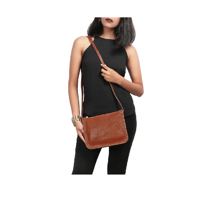 Monogrammed clutch as a personalized evening accessoryCARMEL 01 SLING BAG