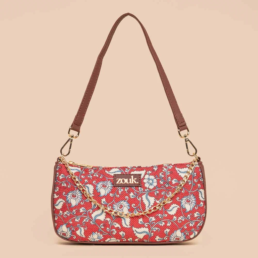 Laser - cut leather evening bag with an intricate patternChittoor Red Kalamkari Baguette