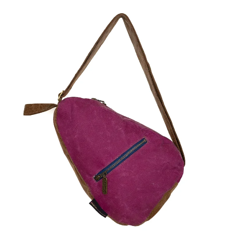 Women's leather crossbody bag with a tassel charm for a bohemian styleKatie Premier: Raspberry Waxed Canvas Women's leather crossbody bag with a tassel charm for a bohemian styleKatie Premier: Raspberry Waxed Canvas