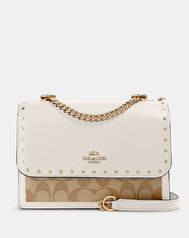 Women's leather crossbody bag with a tassel charm for a bohemian styleKlare Medium Crossbody With Rivets