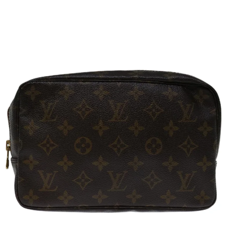 Monogrammed clutch as a personalized evening accessoryLouis Vuitton Trousse De Toilette  Canvas Clutch Bag (Pre-Owned)