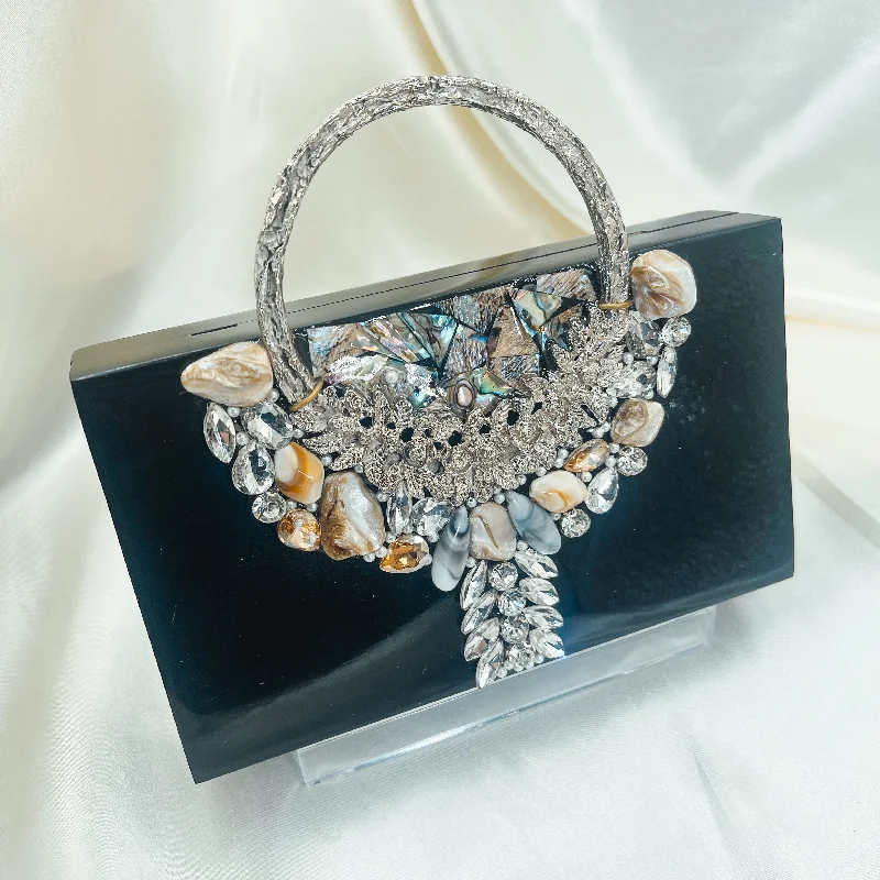 Mother - of - pearl clutch with a delicate sheenMEENA Resin Clutch