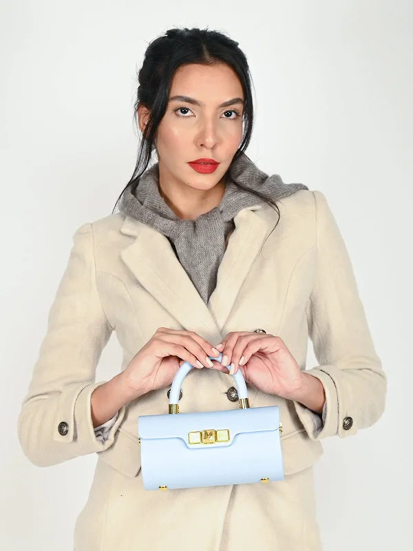 Velvet clutch with a tassel detail for a bohemian - chic styleOdette Blue Structrued Clutch Bag For Women