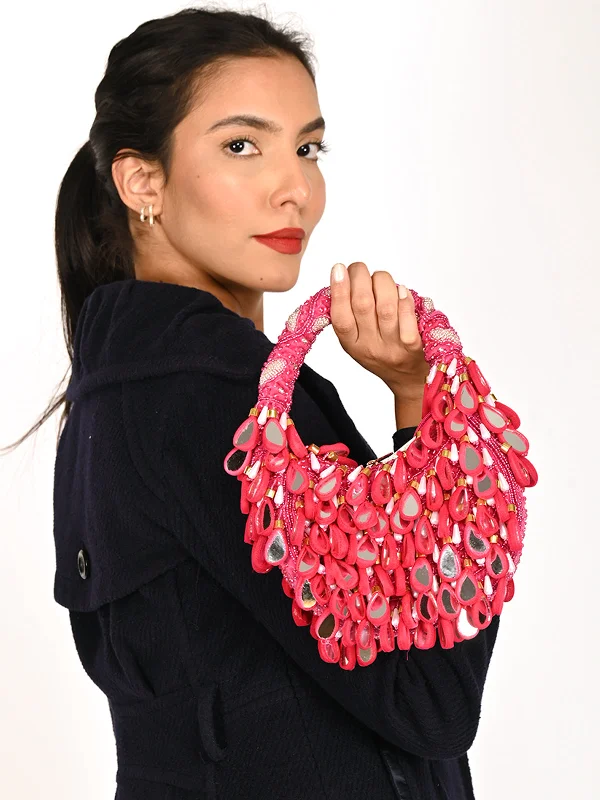Velvet clutch with a tassel detail for a bohemian - chic styleOdette Magenta Tasseled Moon Clutch For Women Velvet clutch with a tassel detail for a bohemian - chic styleOdette Magenta Tasseled Moon Clutch For Women