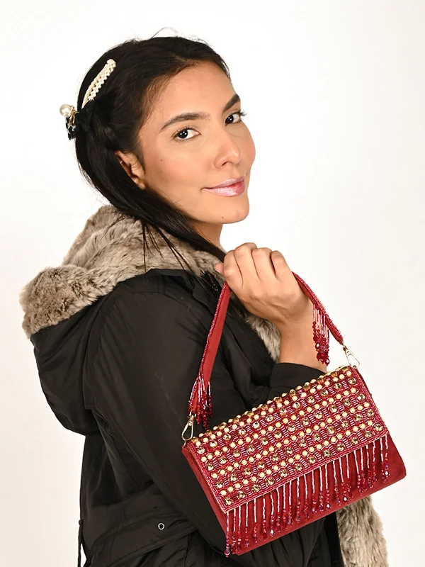 Sequined clutch in a metallic color for a party lookOdette Maroon Embroidered Tasseled Bridal Clutch For Women Sequined clutch in a metallic color for a party lookOdette Maroon Embroidered Tasseled Bridal Clutch For Women