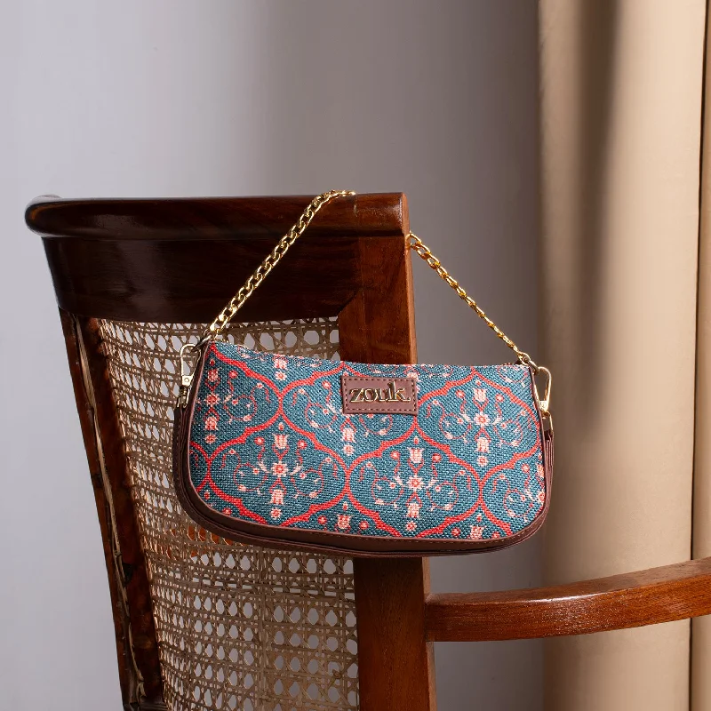Leather evening bag with a gold - plated chain strap for a sophisticated lookSheesh Mahal Jaali Motif Baguette Leather evening bag with a gold - plated chain strap for a sophisticated lookSheesh Mahal Jaali Motif Baguette