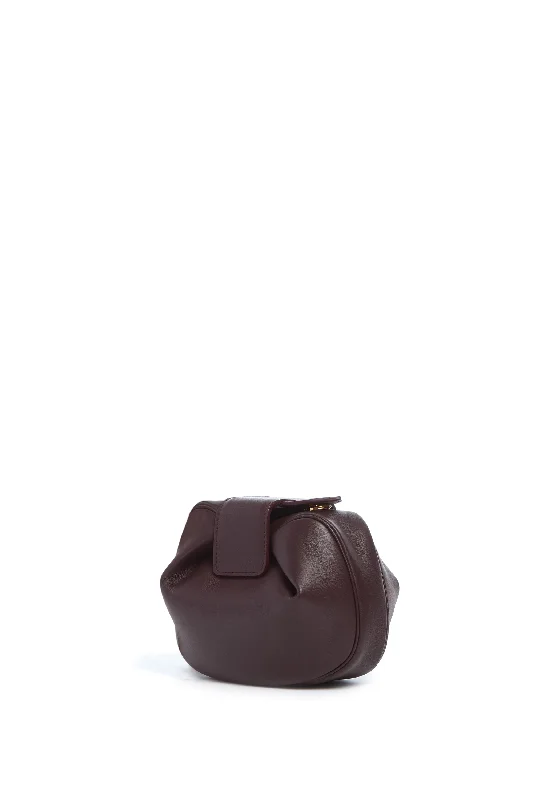 Clutch with a removable strap to be used as a hand - held or cross - bodySoft Demi Clutch in Bordeaux Nappa Leather Clutch with a removable strap to be used as a hand - held or cross - bodySoft Demi Clutch in Bordeaux Nappa Leather