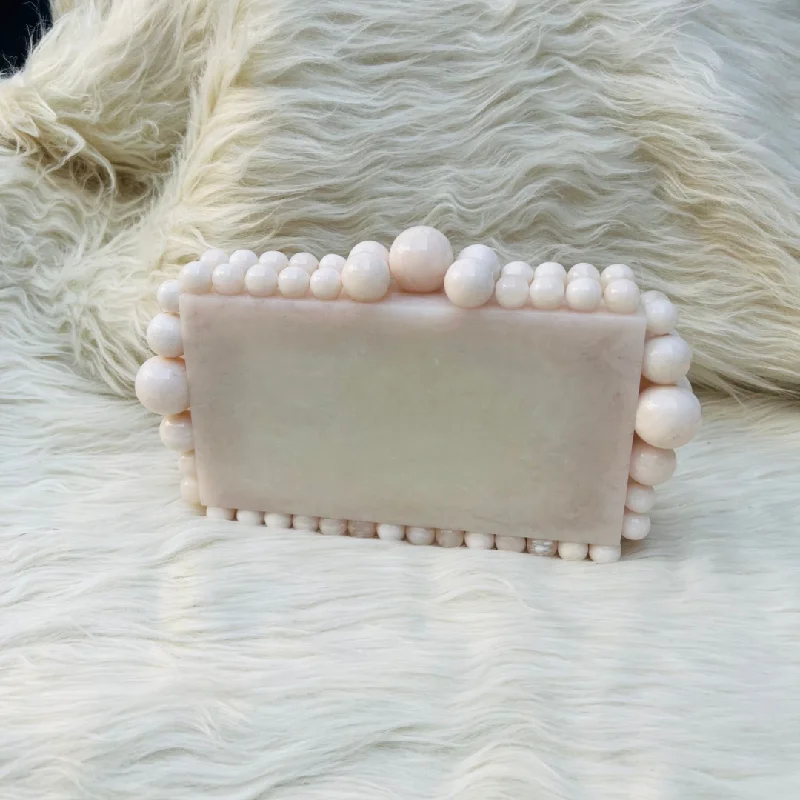 Two - tone clutch with a contrast color lining for added styleTARA Clutch (Ivory)